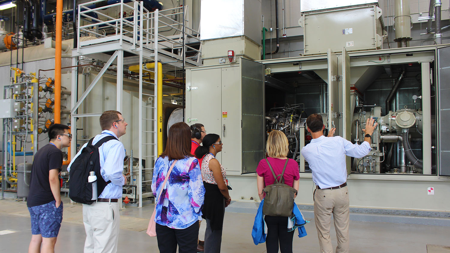 Visitors take a tour to the Centennial Campus Utility Plant